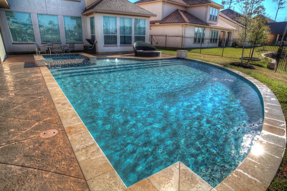 Photo of a mediterranean pool in Houston.