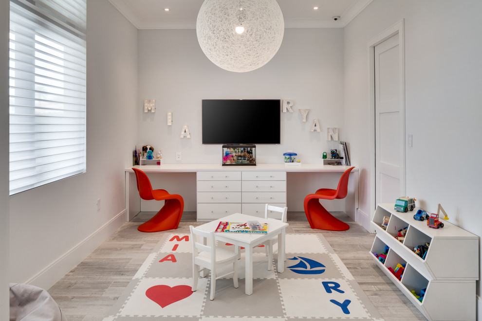 Mid-sized beach style gender-neutral kids' playroom in Miami with white walls, grey floor and porcelain floors for kids 4-10 years old.