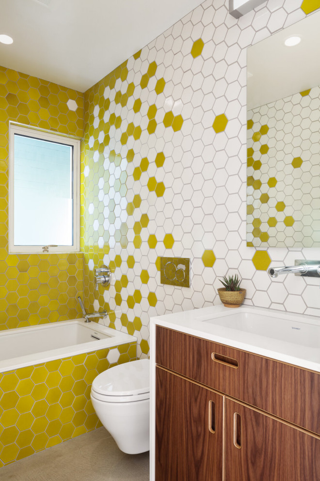 Retro family bathroom in San Francisco with multi-coloured tiles and multi-coloured walls.