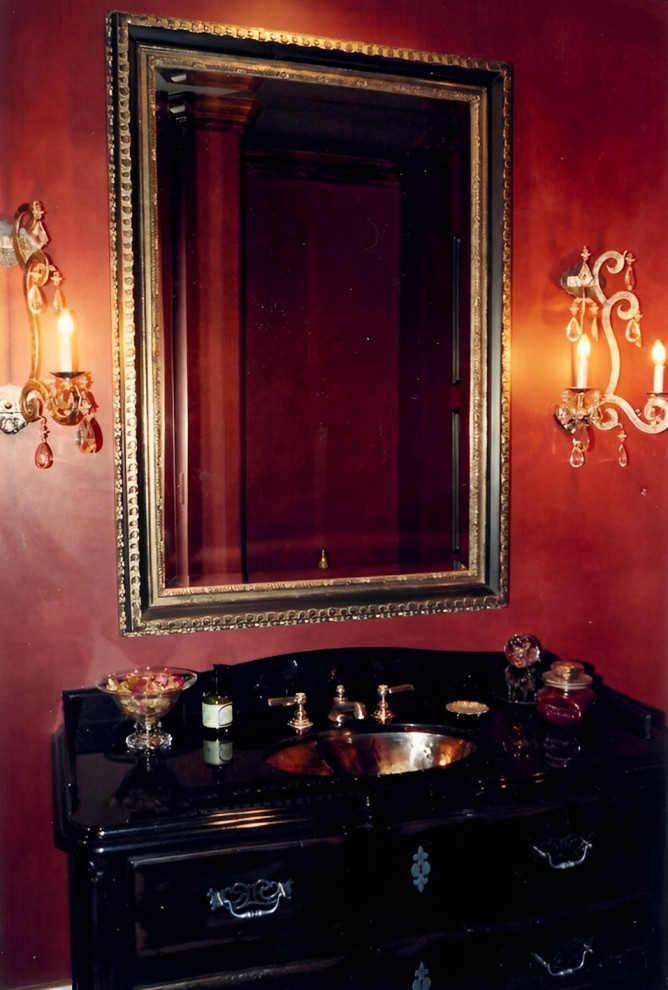 Photo of a medium sized cloakroom in Other with freestanding cabinets, dark wood cabinets, a one-piece toilet, red tiles, red walls, slate flooring, a submerged sink, granite worktops, grey floors, black worktops and a freestanding vanity unit.