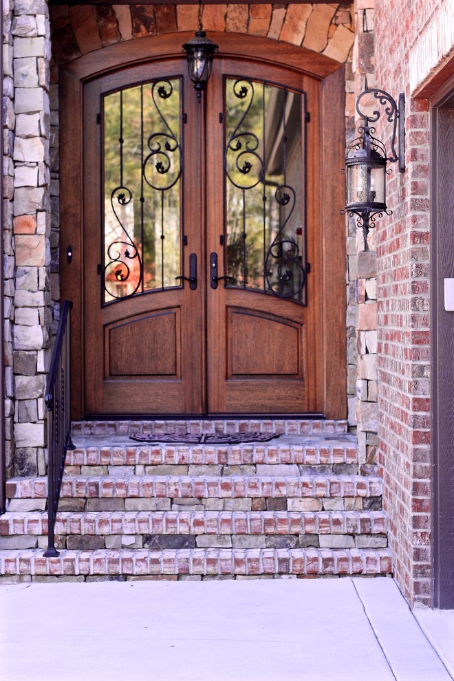 Mid-sized transitional front door photo in Raleigh with a medium wood front door