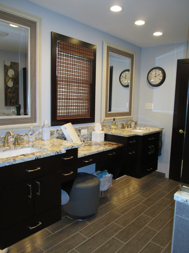 Inspiration for a mid-sized transitional bathroom remodel with an undermount sink and granite countertops