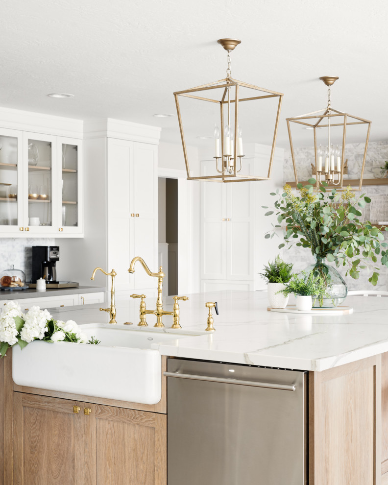 Photo of a large scandinavian u-shaped eat-in kitchen in San Francisco with a farmhouse sink, recessed-panel cabinets, white cabinets, quartzite benchtops, white splashback, marble splashback, stainless steel appliances, light hardwood floors, with island, beige floor and white benchtop.
