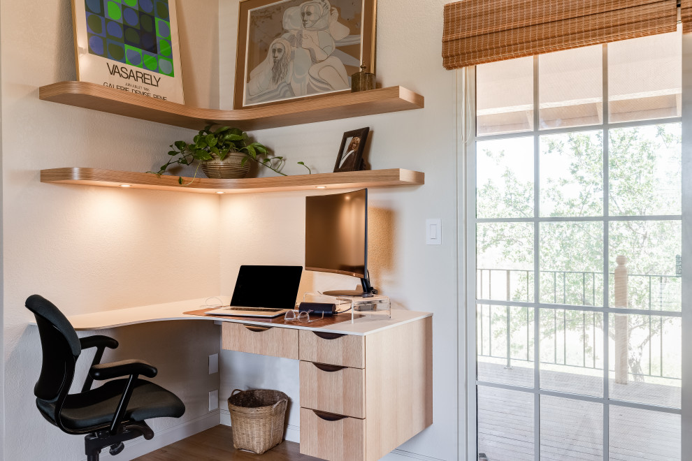 Design ideas for a large transitional home office in Sacramento with white walls, medium hardwood floors, no fireplace, a built-in desk and vaulted.