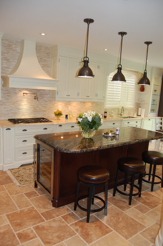 Example of a large transitional u-shaped ceramic tile eat-in kitchen design in Toronto with an undermount sink, shaker cabinets, white cabinets, granite countertops, multicolored backsplash, matchstick tile backsplash, white appliances and an island
