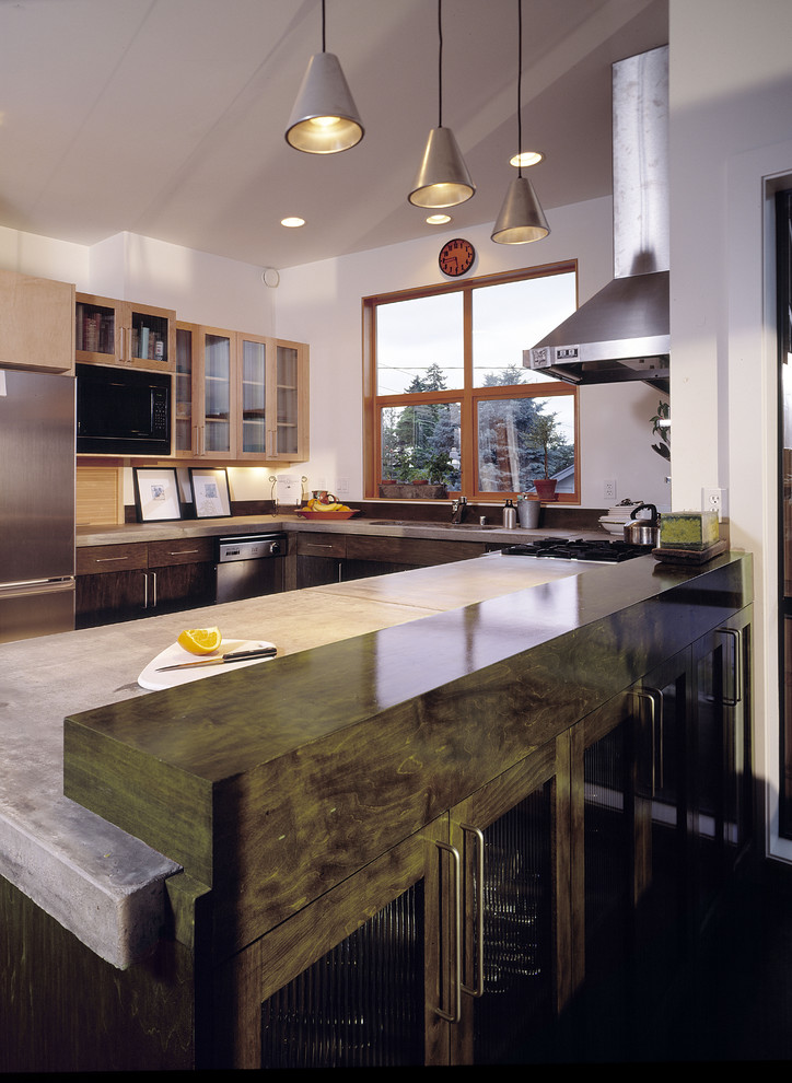 Design ideas for a contemporary kitchen in Seattle with concrete benchtops and stainless steel appliances.