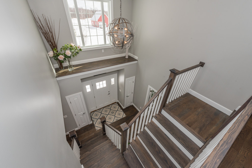This is an example of a mid-sized transitional staircase in New York.