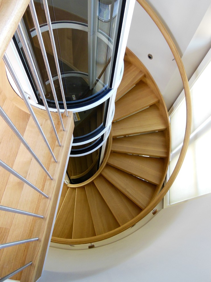 Inspiration for a large contemporary wood floating staircase in Richmond with wood risers.