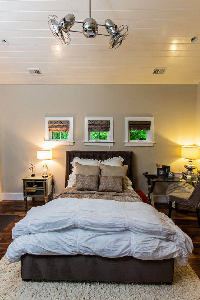 Photo of a transitional bedroom in Charleston with grey walls.