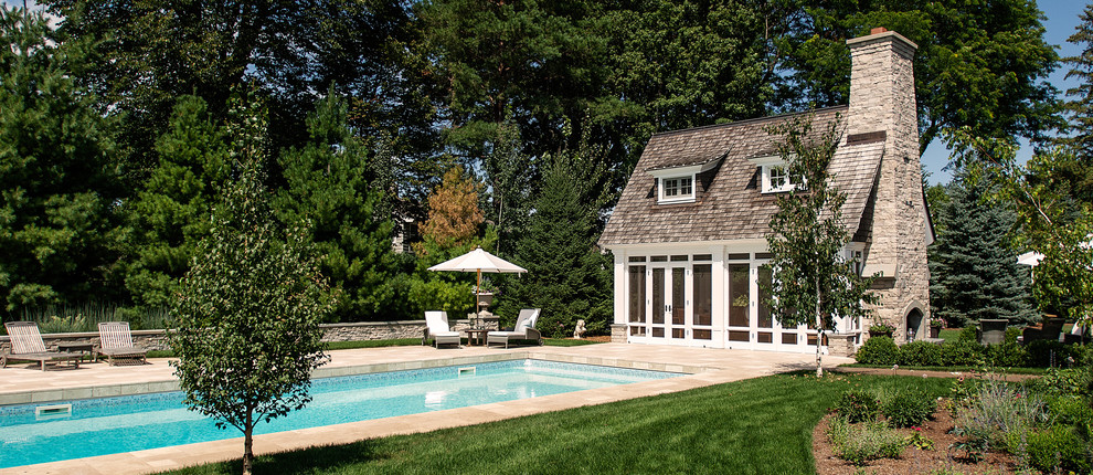 Design ideas for a traditional rectangular pool in Minneapolis with a pool house.
