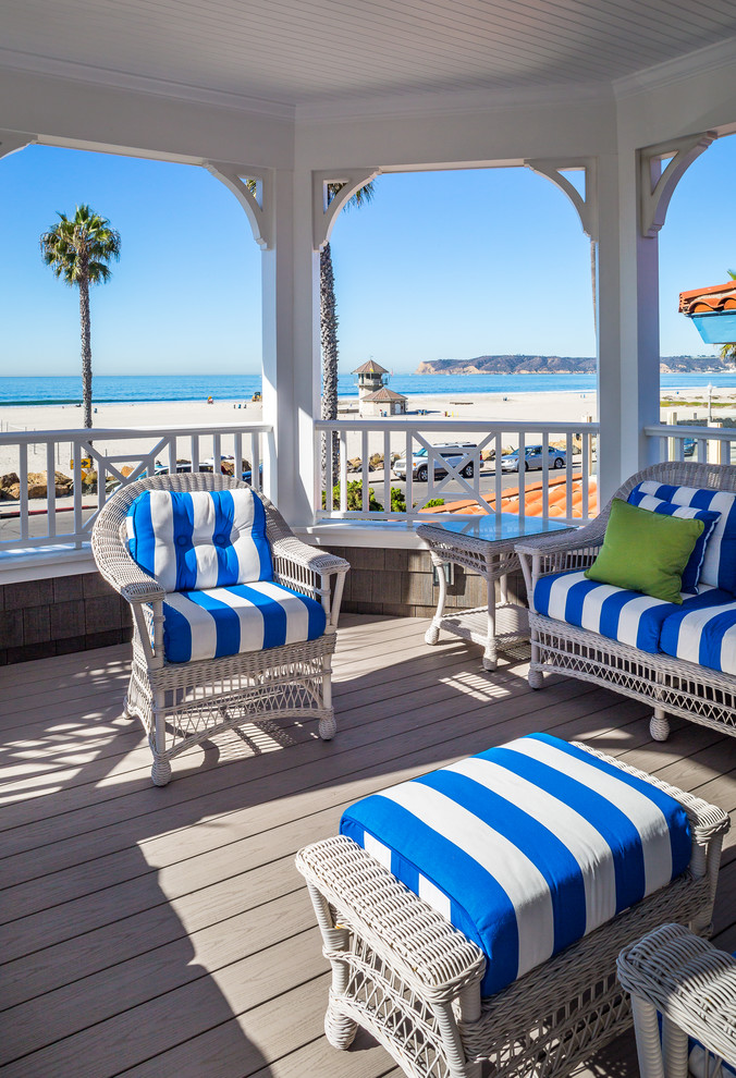 Design ideas for a large beach style side yard deck in San Diego with no cover.