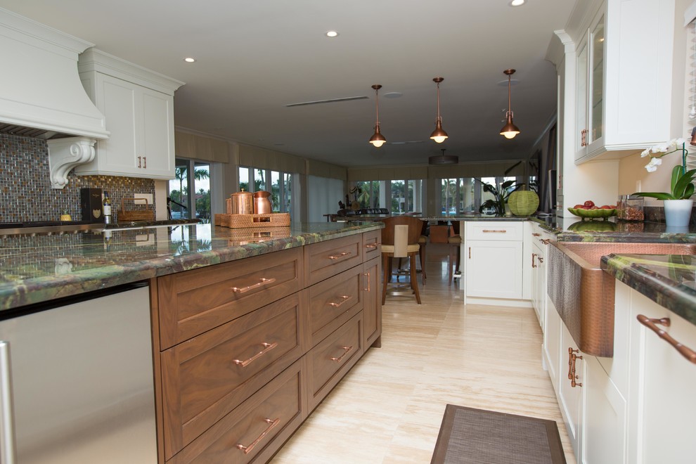 Inspiration for a large transitional u-shaped light wood floor open concept kitchen remodel in Miami with a farmhouse sink, shaker cabinets, stainless steel appliances, an island, white cabinets, granite countertops, metallic backsplash and mosaic tile backsplash