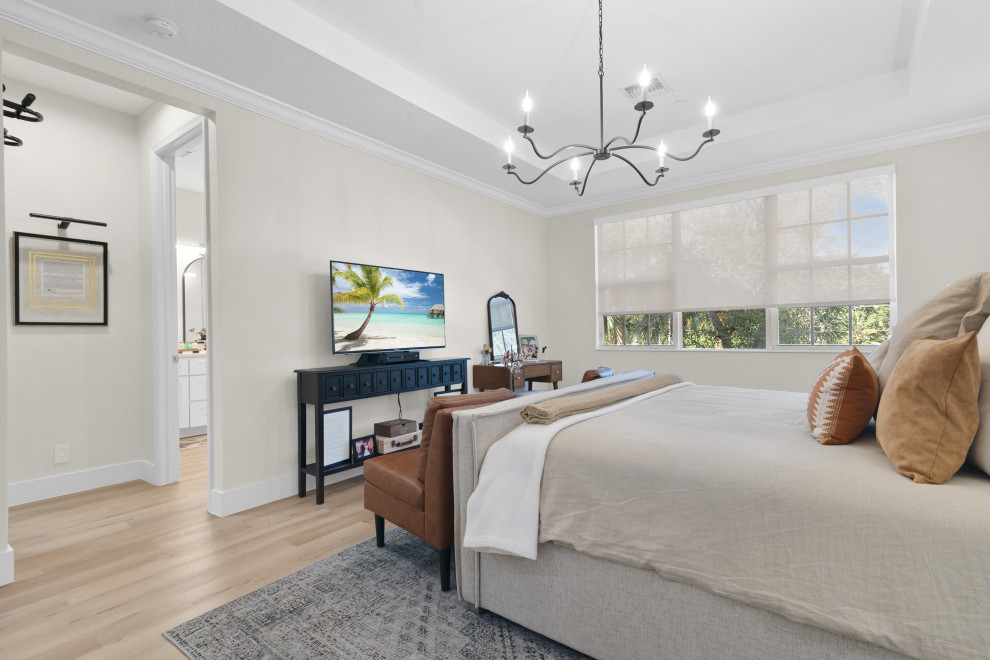 Medium sized scandinavian master bedroom in Miami with white walls, vinyl flooring, no fireplace, beige floors and a vaulted ceiling.