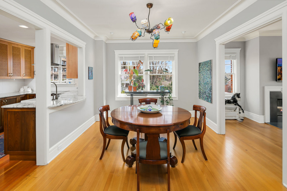 Photo of a traditional dining room in Seattle with light hardwood floors.