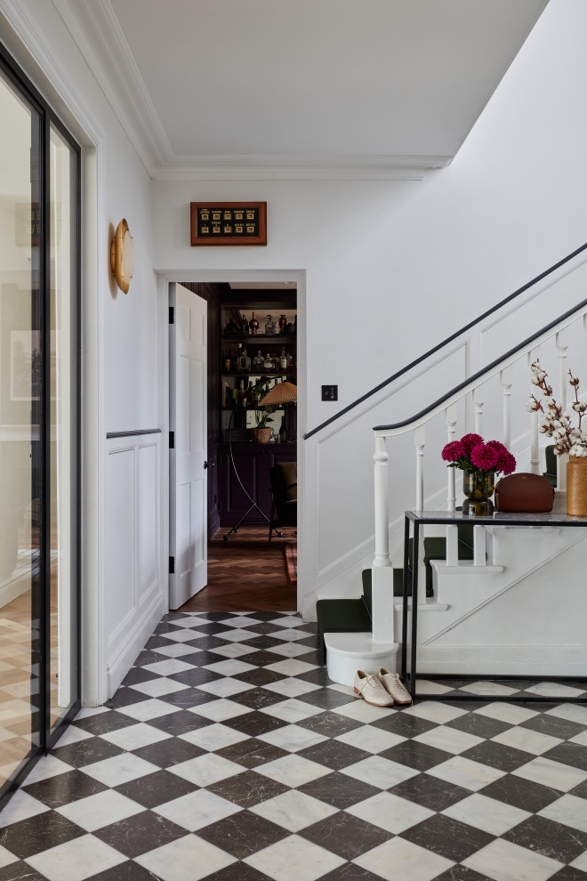 Inspiration for a large contemporary foyer in London with marble floors, a double front door, a blue front door and multi-coloured floor.