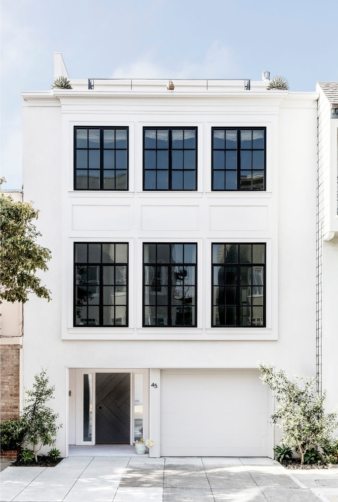 Transitional three-storey white house exterior in San Francisco with a flat roof.