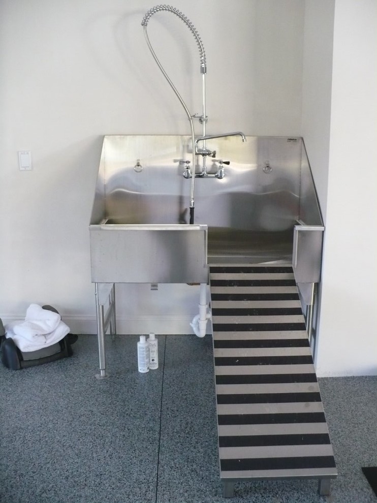 Inspiration for a large industrial laundry room in Ottawa with an utility sink.