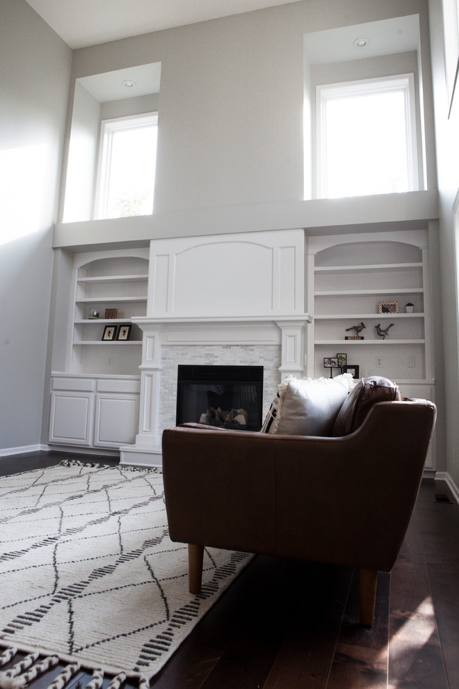 Home design - huge transitional open concept dark wood floor and brown floor home design idea with gray walls, a standard fireplace, a tile fireplace and no tv