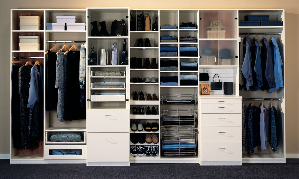 This is an example of a large traditional gender-neutral built-in wardrobe in Los Angeles with white cabinets and flat-panel cabinets.