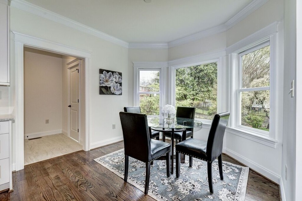 Inspiration for a large transitional medium tone wood floor dining room remodel in DC Metro with white walls and no fireplace