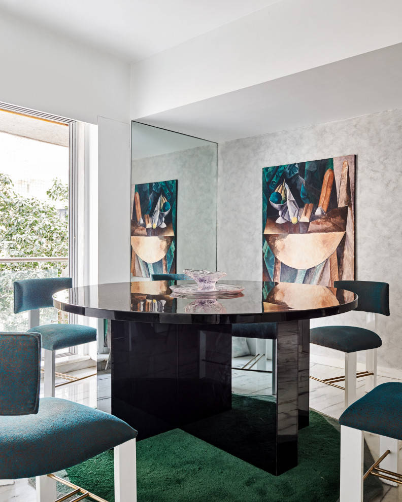 This is an example of a mid-sized contemporary dining room in Mumbai with white walls and grey floor.