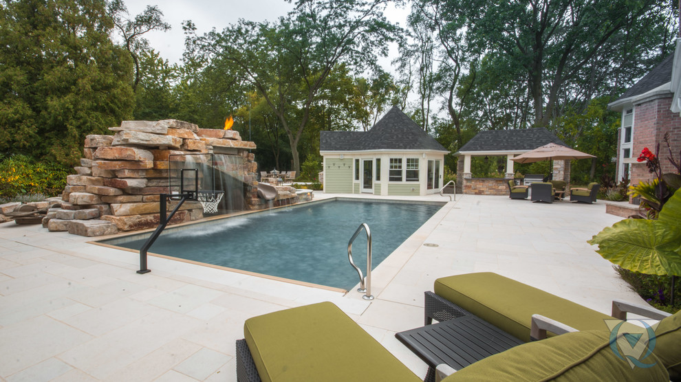 Inspiration for a large rustic backyard rectangular lap water slide remodel in Chicago