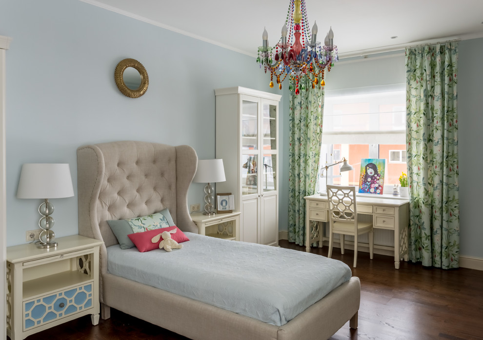 This is an example of a traditional kids' room for girls in Moscow with blue walls and dark hardwood floors.