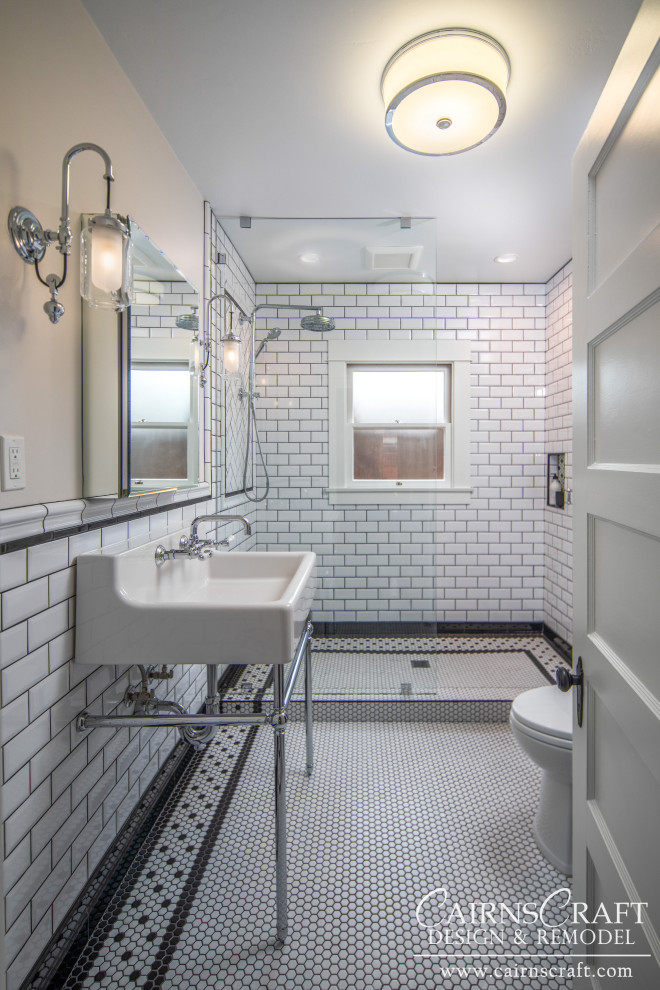 Small traditional shower room bathroom in San Diego with a walk-in shower, a two-piece toilet, black and white tiles, metro tiles, white walls, mosaic tile flooring, a wall-mounted sink, white floors, an open shower, a wall niche, a single sink and wainscoting.