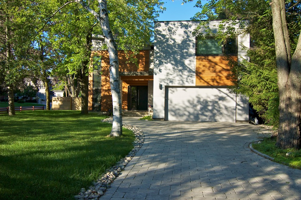 This is an example of a modern exterior in Toronto with wood siding.