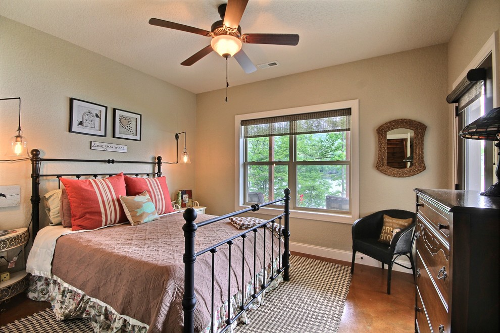 Mid-sized arts and crafts guest bedroom in Atlanta with beige walls and concrete floors.