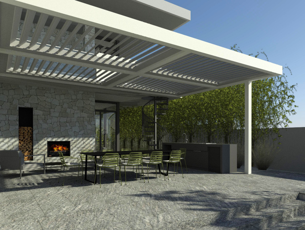 Inspiration for a large beach style side yard verandah in Perth with an outdoor kitchen, natural stone pavers and a pergola.