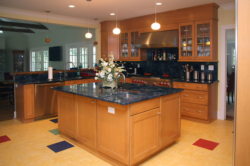 Inspiration for a large transitional u-shaped open concept kitchen remodel with an undermount sink, recessed-panel cabinets, medium tone wood cabinets, stainless steel appliances and an island