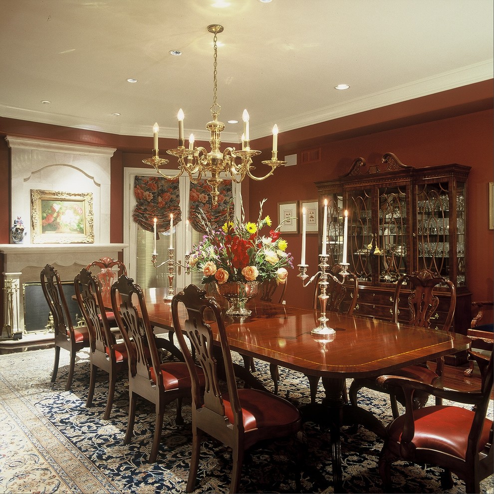 Photo of a large traditional separate dining room in Phoenix with red walls.