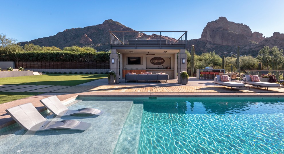 Design ideas for a contemporary backyard pool in Phoenix.