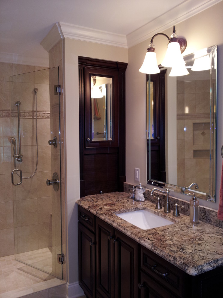 Large traditional master bathroom in Other with an undermount sink, raised-panel cabinets, dark wood cabinets, granite benchtops, an alcove shower, a two-piece toilet, beige tile, ceramic tile, beige walls and porcelain floors.
