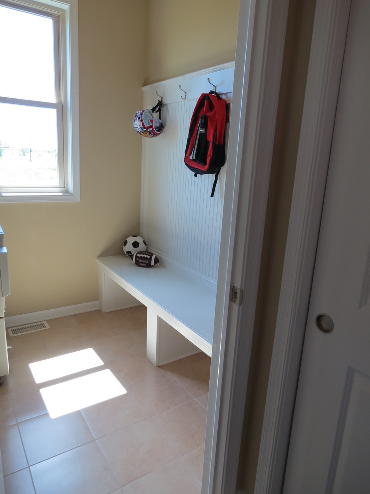Example of a transitional dark wood floor entryway design in Chicago