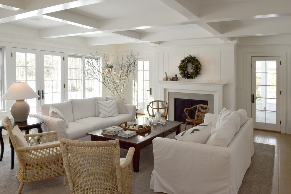 Large scandinavian living room in Chicago with white walls, medium hardwood floors, a standard fireplace, a tile fireplace surround, brown floor, coffered and planked wall panelling.