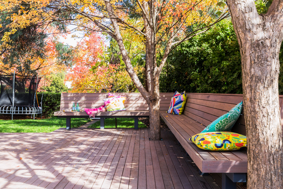 This is an example of a large contemporary backyard deck in Canberra - Queanbeyan with no cover.