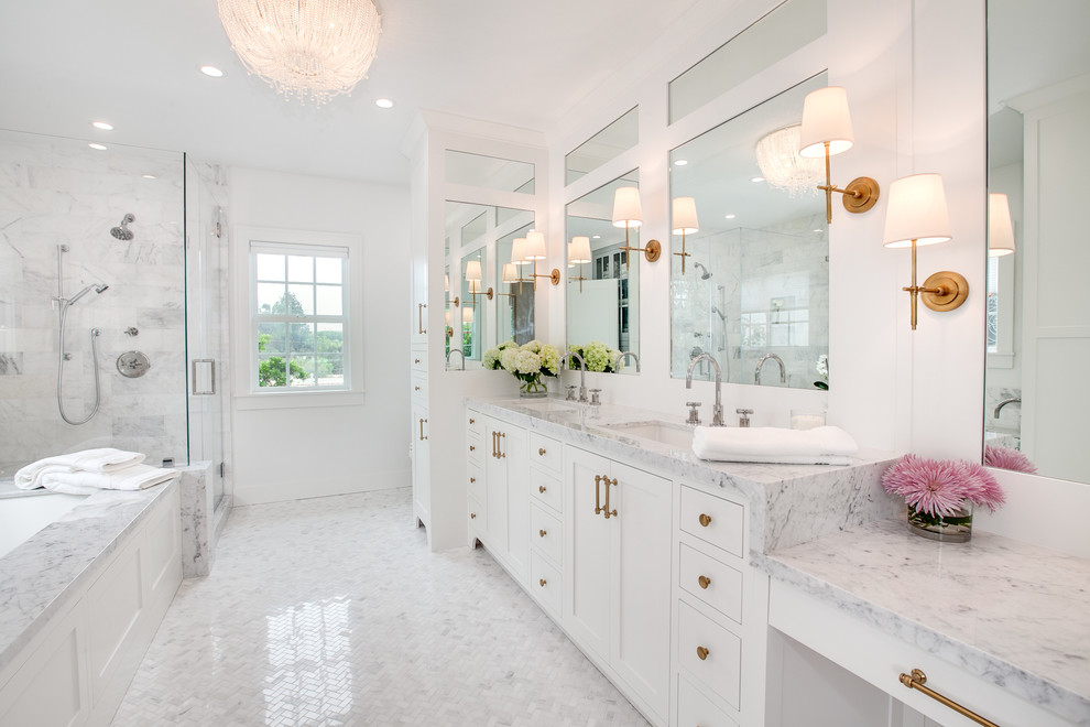 Design ideas for a transitional master bathroom in San Diego with white cabinets, a corner shower, white tile, marble, white walls, marble floors, an undermount sink, marble benchtops, white floor, white benchtops, shaker cabinets, an undermount tub and a hinged shower door.