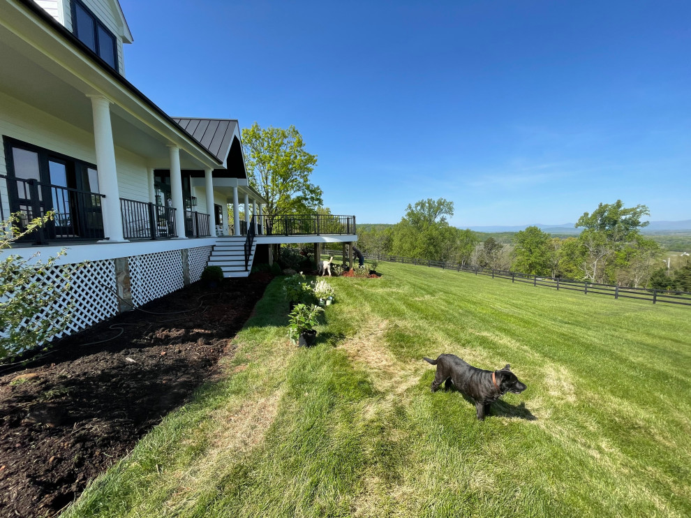 This is an example of a farmhouse landscaping in Other.