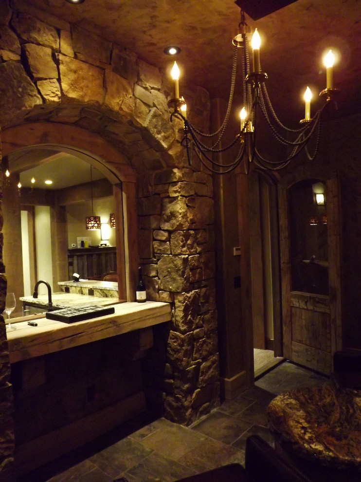 Example of a mountain style wine cellar design in Seattle