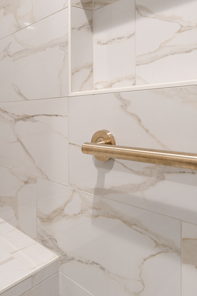 Transitional white tile and porcelain tile alcove shower photo in Minneapolis with beige walls and a hinged shower door