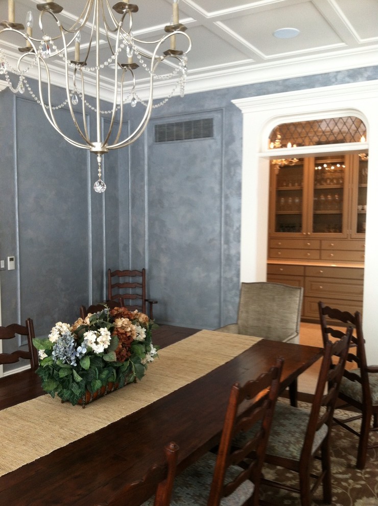 This is an example of a large traditional separate dining room in Grand Rapids with metallic walls, carpet and no fireplace.