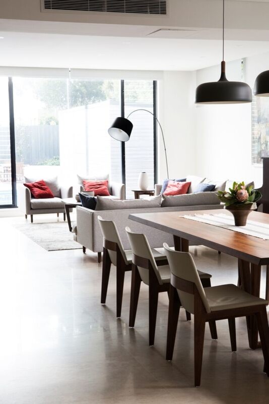 Inspiration for a mid-sized contemporary open plan dining in Sydney with white walls and beige floor.