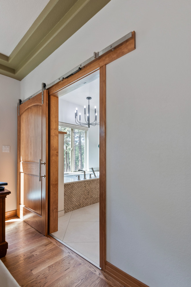 Example of a transitional home design design in Denver