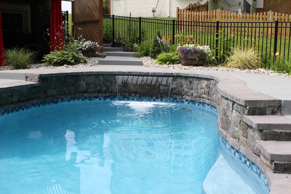 Inspiration for a small country backyard custom-shaped natural pool in DC Metro with decking.