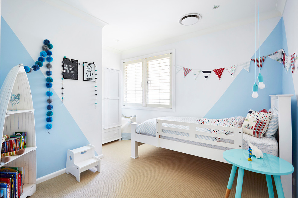 Scandinavian kids' room in Sydney with carpet and multi-coloured walls for boys.