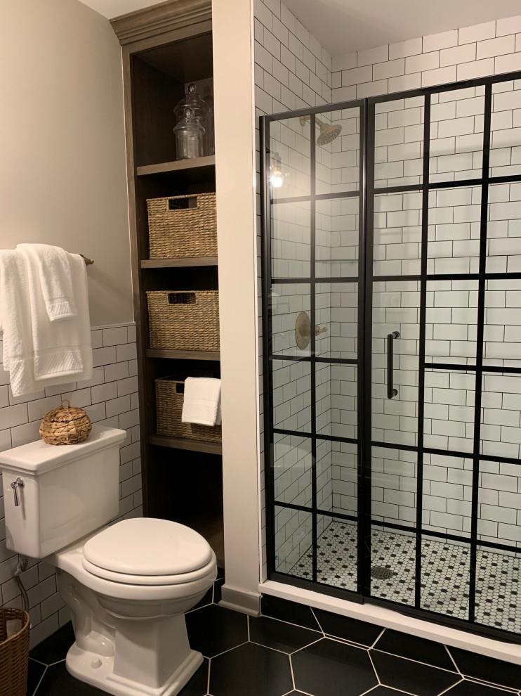 This is an example of a mid-sized country bathroom in Chicago with beige walls, vinyl floors and brown floor.
