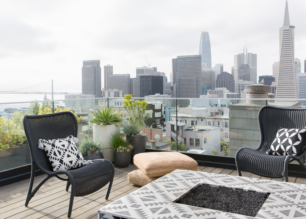 Design ideas for a mid-sized scandinavian rooftop deck in San Francisco with a fire feature and no cover.