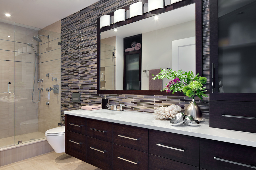Design ideas for a large contemporary master bathroom in New York with flat-panel cabinets, dark wood cabinets, an alcove shower, a wall-mount toilet, multi-coloured tile, matchstick tile, beige walls, porcelain floors, an undermount sink, engineered quartz benchtops, brown floor and a hinged shower door.